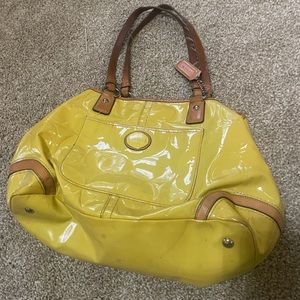 Bright yellow Coach shoulder bag.